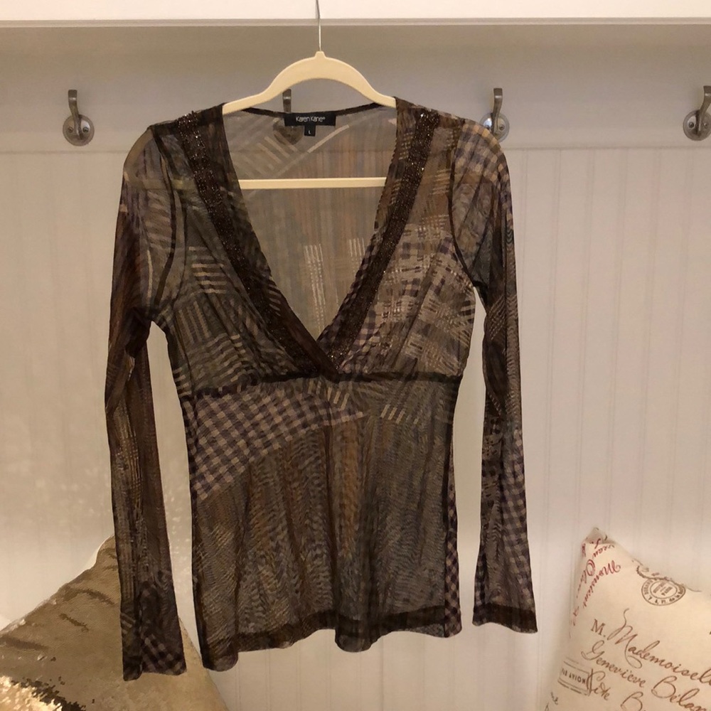 Beautiful sheer blouse with detailed beading